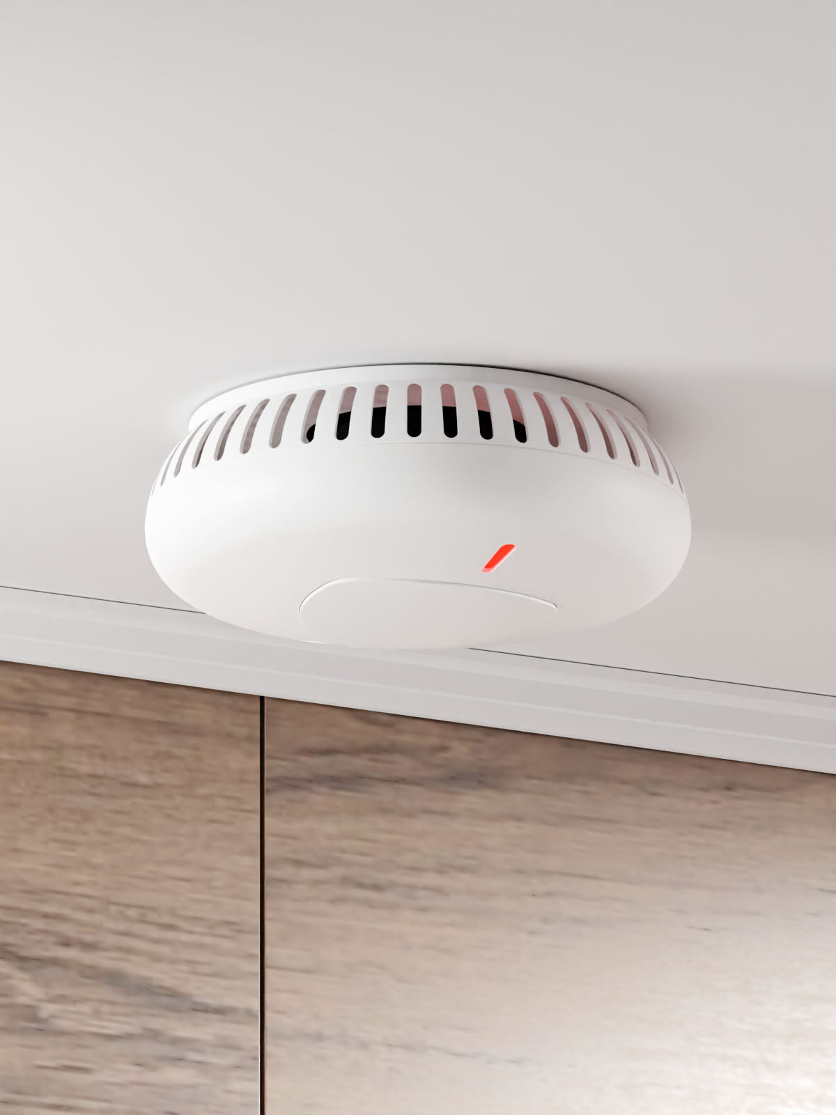 Staniot SK030, Smart Photoelectric Smoke Alarm positioned on ceiling with wooden drawers appearing near the back