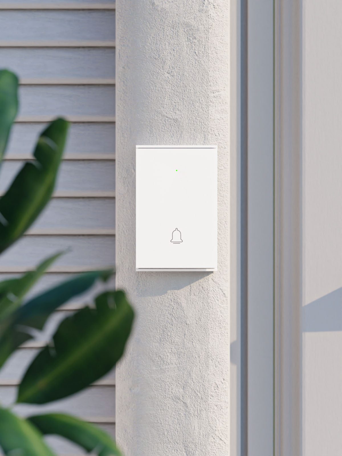 B100 Wireless Door Bell positioned near front home entry against stucco wall