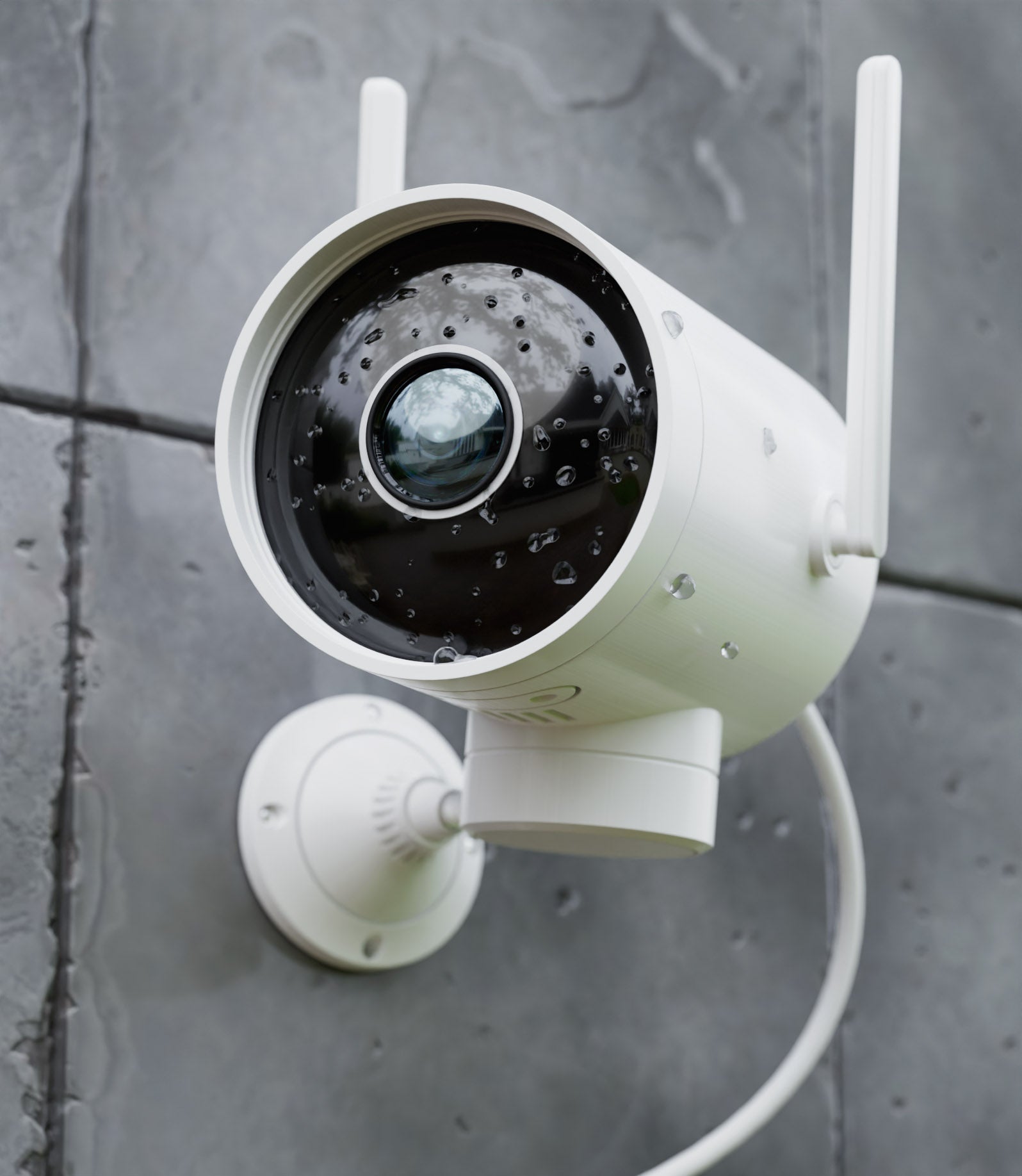 white-commecial-security-camera-bolted-on-grey-wall-tiles-outdoors-facing-left-with-its-black-lens-glowing-while-getting-hit-by-raindrops