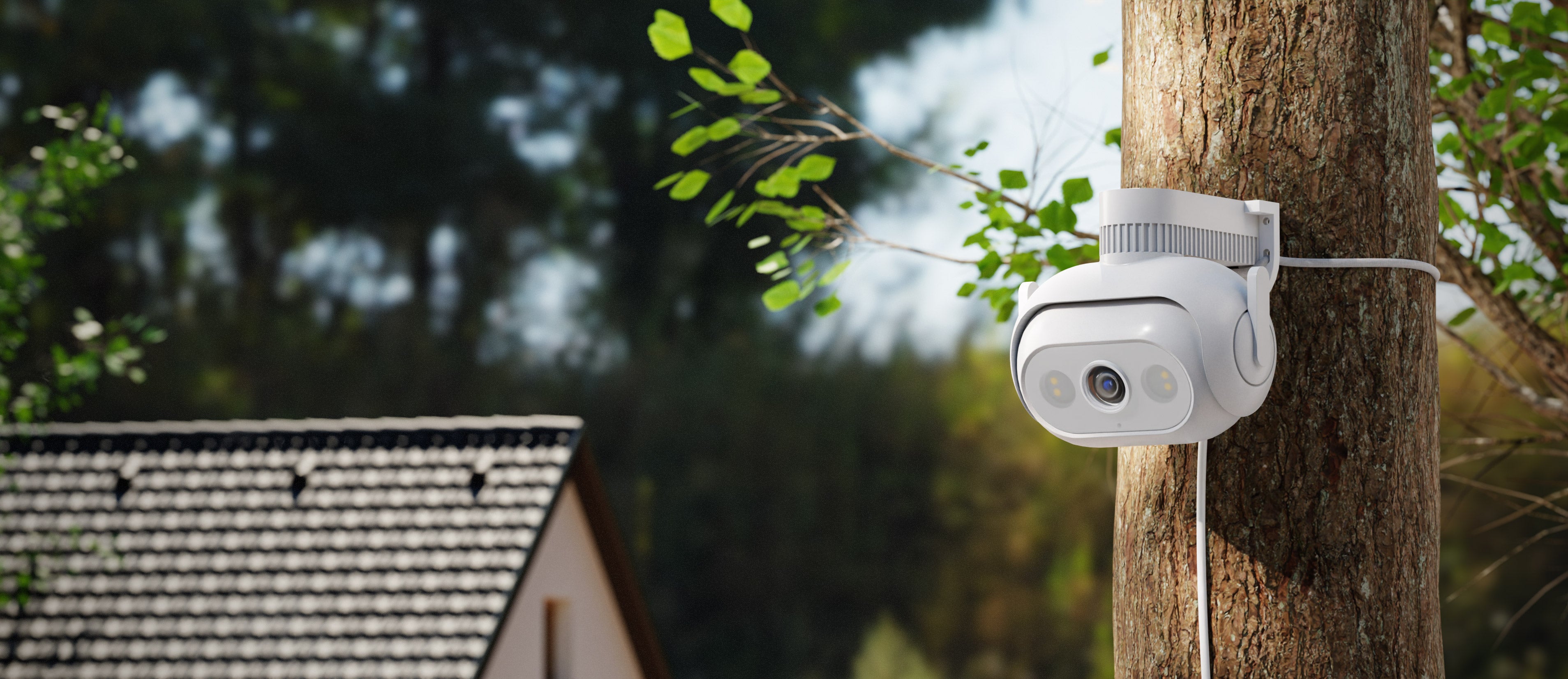 Imilab-ec5-surveilance-white-security-camera-fixed-on-tree-bark-with-bracket-house-and-trees-on-background-sunny-day