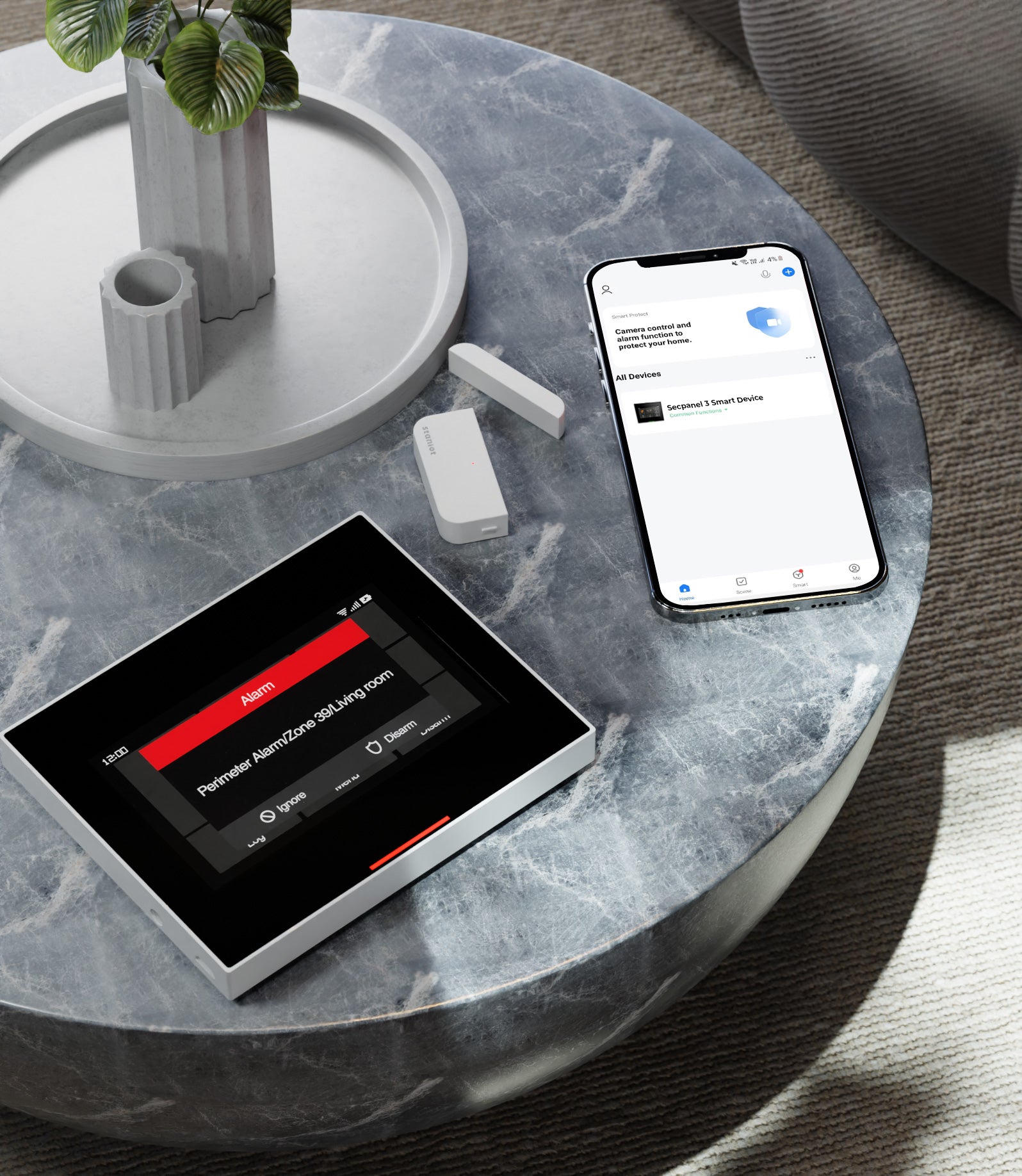Staniot SecPanel 3 security system wireless display connected to mobile device Tuya Smart Life app on top of dark marble coffee table in home living room