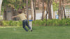 real-time-view-of-security-camera-tracking-young-boy-running-in-green-grass-park